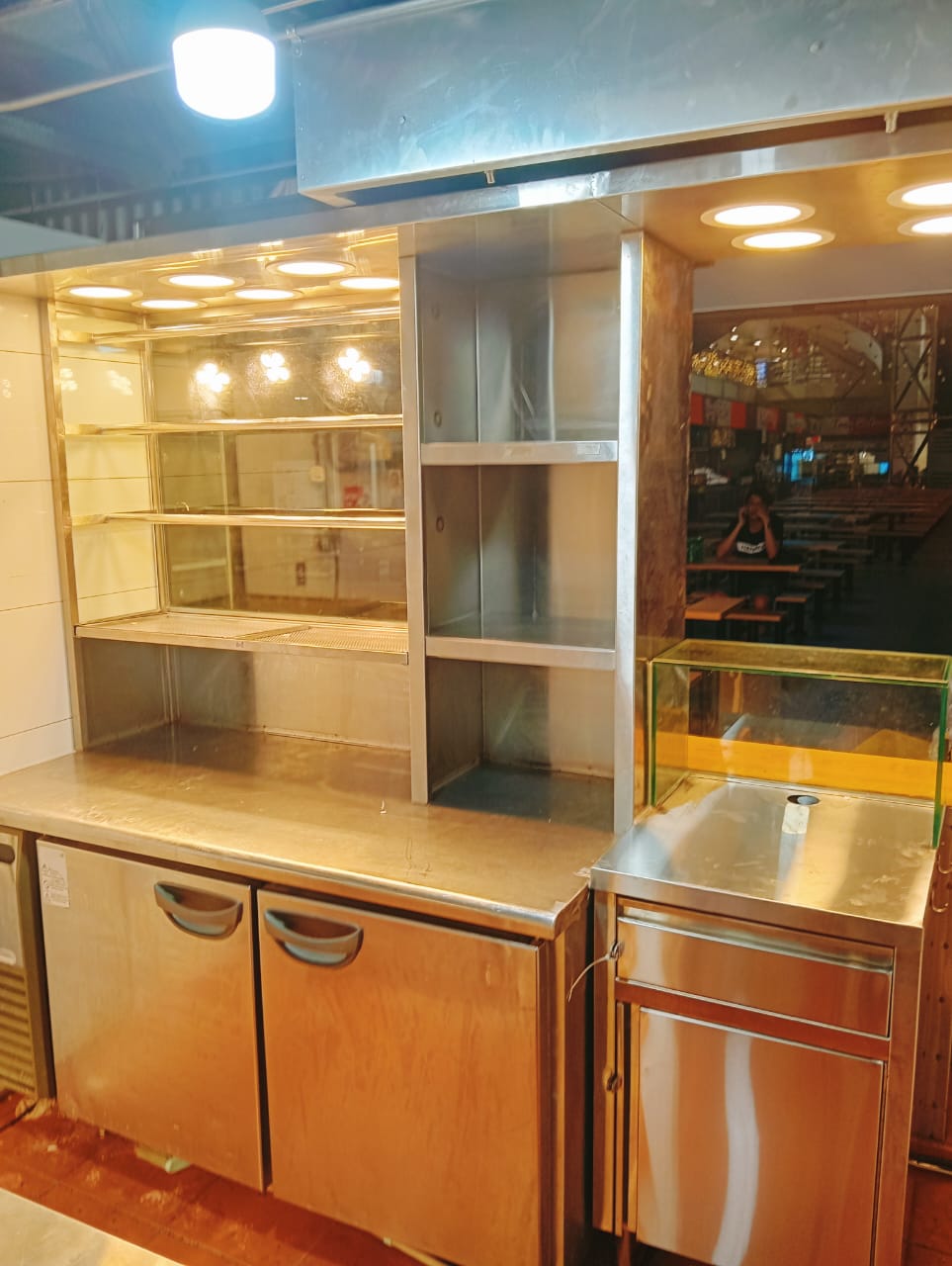 Undercounter chiller with glass display shelving installed at a foodcourt stall