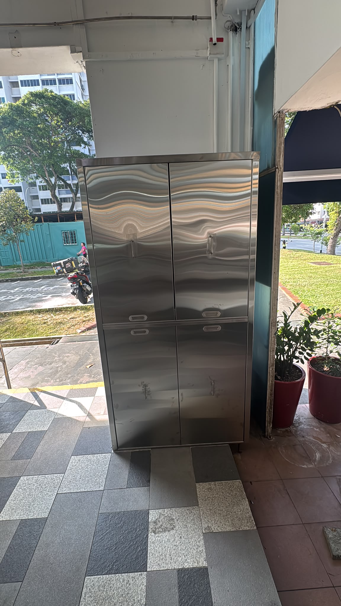 Stainless steel four-door cabinet at the shopfront